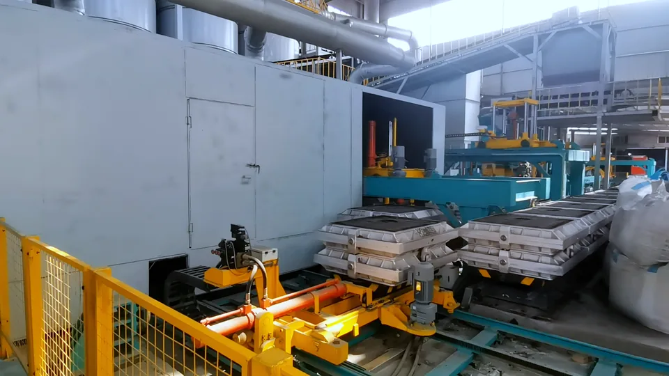 Poured molds moving along the cooling line conveyor