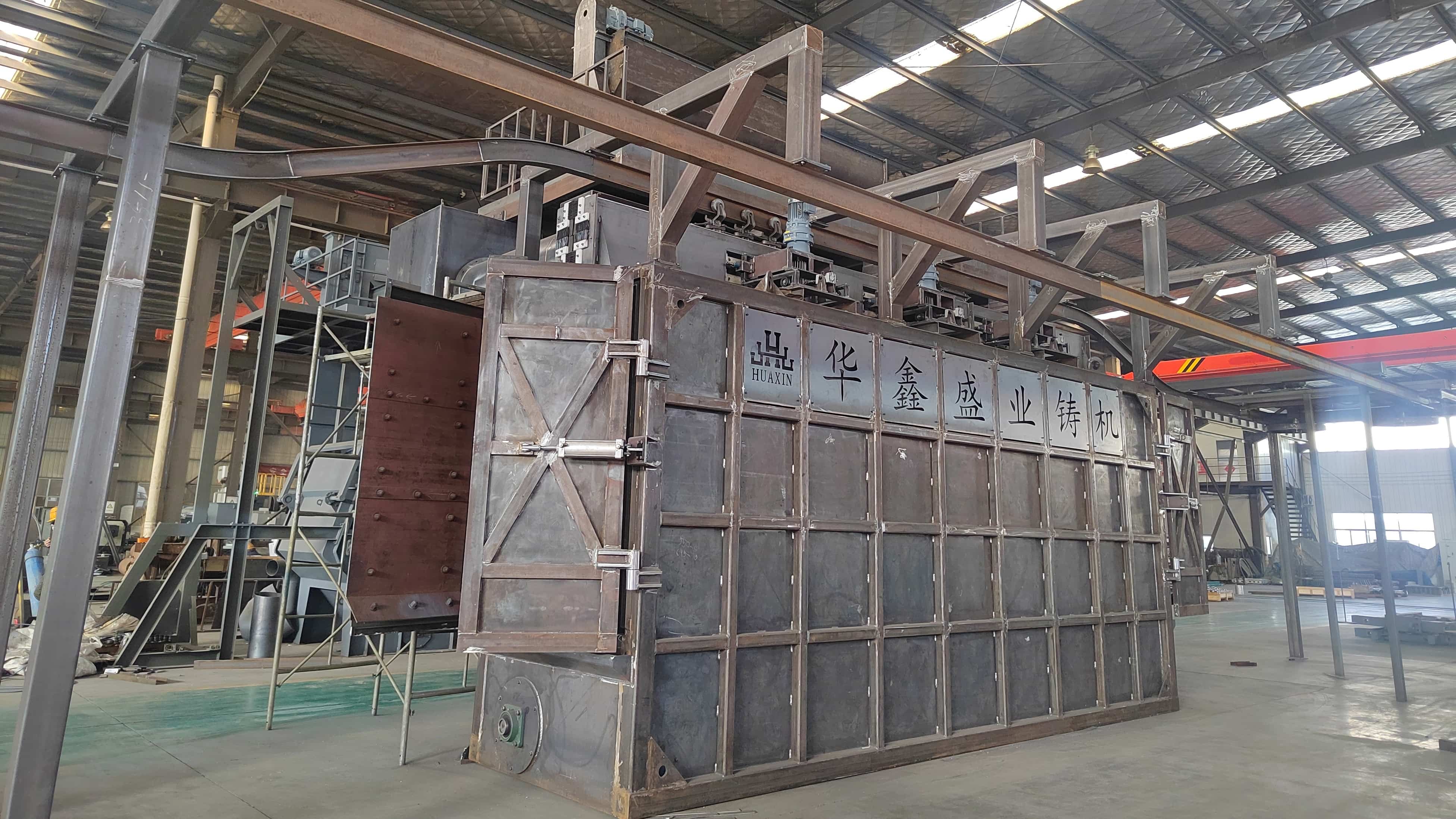 Overhead conveyor shot blasting machine side equipment view